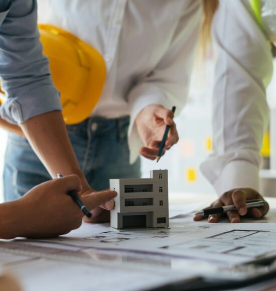 Engineers working together on a building project.