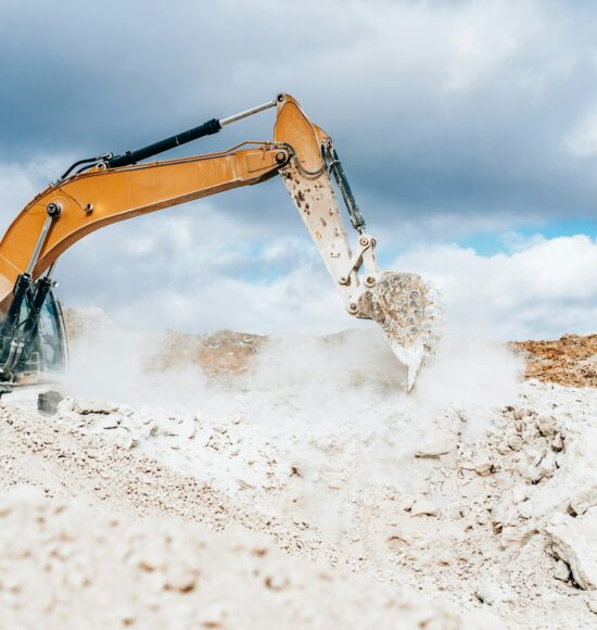 Wheel loader, large bucket with limestone. Construction. Open pit mining quarry